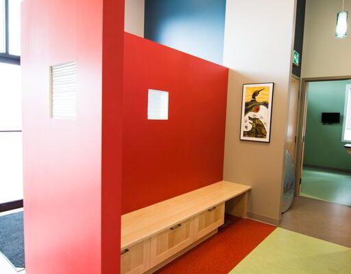 Cat Waiting area at East St. Paul Animal Hospital - Manitoba - sitting area with a red wall